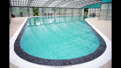 Agnish Rakesh with his team showing newly renovated swimming pool of Chandigarh Golf Club on Friday (Ravi Kumar/HT)
