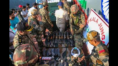 Army personnel display arms recovered after foiling an infiltration bid along the LoC in Kupwara, Jammu and Kashmir on Friday. (PTI) Army personnel display arms recovered after foiling an infiltration bid along the LoC in Kupwara, Jammu and Kashmir on Friday. (PTI)