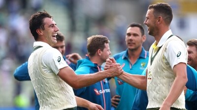 Australia's Pat Cummins shakes hands with Josh Hazlewood after wining the first Test (Action Images via Reuters)