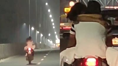 Couple doing PDA on a moving bike. (Twitter/@Akashkchoudhary) Couple doing PDA on a moving bike. (Twitter/@Akashkchoudhary)