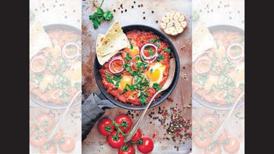 Shakshuka, which originated in North Africa, is not difficult to make and the ingredients are inexpensive; most countries have their own version of the dish. (Shutterstock) Shakshuka, which originated in North Africa, is not difficult to make and the ingredients are inexpensive; most countries have their own version of the dish. (Shutterstock)