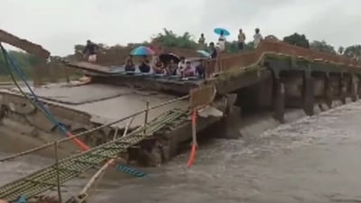 A bridge located in Tamulpur's Kumarikata area washed away due to flood-like conditions brought about by relentless rainfall in the region. (ANI) A bridge located in Tamulpur's Kumarikata area washed away due to flood-like conditions brought about by relentless rainfall in the region. (ANI)