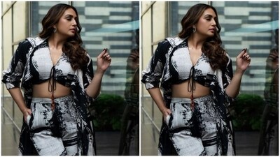 Huma decked up in a monochrome cropped top with a plunging neckline and a knot detail. Showing off her toned midriff, she teamed it with a pair of matching cotton palazzos. In a long monochrome shrug, she completed her look. (Instagram/@iamhumaq) Huma decked up in a monochrome cropped top with a plunging neckline and a knot detail. Showing off her toned midriff, she teamed it with a pair of matching cotton palazzos. In a long monochrome shrug, she completed her look. (Instagram/@iamhumaq)
