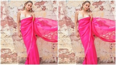 Kiara decked up in a bright pink organza saree and teamed it with a contrasting white sleeveless lace blouse.&nbsp; (Instagram/@kiaraaliaadvani)