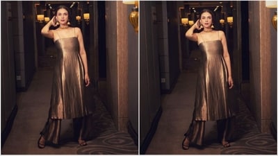 Aditi opted for a stunning metallic kurta from the brand Raw Mango. Her kurta showcased delicate sleeves, a fitted bodice, and a pleated flowy bottom. To complete the ensemble, she paired it with matching flared palazzo pants. (Instagram/@sanamratansi ) Aditi opted for a stunning metallic kurta from the brand Raw Mango. Her kurta showcased delicate sleeves, a fitted bodice, and a pleated flowy bottom. To complete the ensemble, she paired it with matching flared palazzo pants. (Instagram/@sanamratansi )