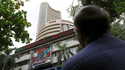 A man looks at a screen across a road displaying the Sensex on the facade of the Bombay Stock Exchange (BSE) building in Mumbai, India. (File image) (REUTERS)