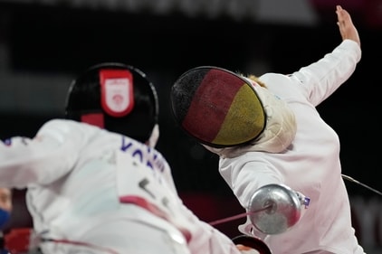 Annika Schleu of Germany, right, and Kim Sunwoo of South Korea compete in the fencing portion of the women's modern pentathlon at the 2020 Summer Olympics, Thursday, Aug. 5, 2021, in Tokyo, Japan. (AP Photo/Andrew Medichini) (AP)