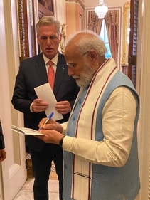 PM Modi giving autograph on his Congress speech today to House Speaker Kevin McCarthy.