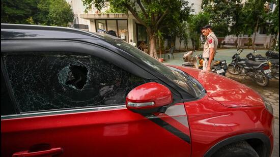 The damaged car window seen after the firing in CR Park in New Delhi on Friday. (Sanchit Khanna/HT PHOTO)