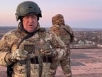 Yevgeny Prigozhin, the chief of the Russian paramilitary group Wagner speaking to the camera from a rooftop at an undisclosed location. (AFP)