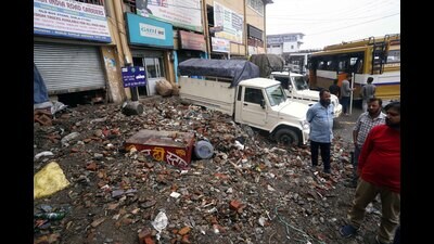 A vehicle buried under debris after heavy rainfall in Shimla on Saturday. (Deepak Sansta/HT) A vehicle buried under debris after heavy rainfall in Shimla on Saturday. (Deepak Sansta/HT)
