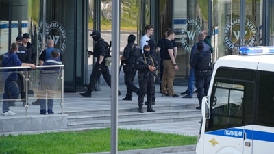 Policemen guard an area near an office of the 'PMC Wagner Centre', which is associated with the owner of the Wagner private military contractor, Yevgeny Prigozhin, in St. Petersburg, Russia, Saturday. The 62-year-old Wagner chief’s audacious challenge to Russian president Vladimir Putin, comes as he accused the Russian top leadership of launching missile strikes against his forces. (AP) Policemen guard an area near an office of the 'PMC Wagner Centre', which is associated with the owner of the Wagner private military contractor, Yevgeny Prigozhin, in St. Petersburg, Russia, Saturday. The 62-year-old Wagner chief’s audacious challenge to Russian president Vladimir Putin, comes as he accused the Russian top leadership of launching missile strikes against his forces. (AP)