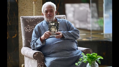 Filmmaker Rahul Rawail with his book Raj Kapoor: The Master at Work in Chandigarh on Friday (Photo: Ravi Kumar/HT)