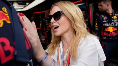 Australian singer Kylie Minogue stands in the Red Bull garage prior to the Monaco Formula One Grand Prix, at the Monaco racetrack, in Monaco, Sunday, May 28, 2023. (AP Photo/Luca Bruno) (AP)