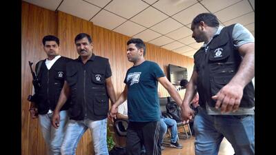 Sandeep alias Bandar in police custody on Saturday. (Parveen Kumar/HT Photo) Sandeep alias Bandar in police custody on Saturday. (Parveen Kumar/HT Photo)
