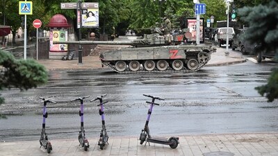 Fighters of Wagner private mercenary group are seen atop of a tank in a street near the headquarters of the Southern Military District in the city of Rostov-on-Don, (Reuters)
