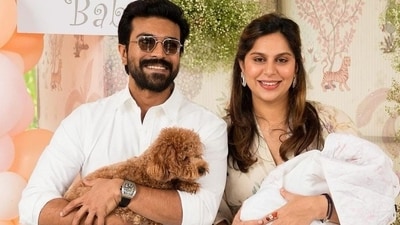Ram Charan and Upasana Konidela holding their newborn baby in their latest Instagram picture.