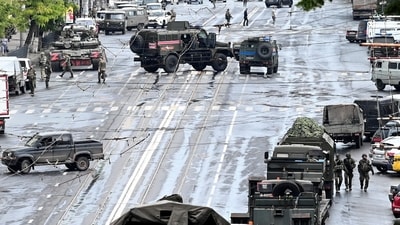 Fighters of Wagner private mercenary group are deployed in a street near the headquarters of the Southern Military District in the city of Rostov-on-Don, Russia. (REUTERS)