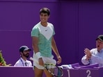 Carlos Alcaraz, of Spain, smiles during his mens singles final match against Alex de Minaur, of Australia, at the Queens Club tennis tournament Carlos Alcaraz, of Spain, smiles during his mens singles final match against Alex de Minaur, of Australia, at the Queens Club tennis tournament