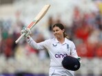 England's Tammy Beaumont acknowledges the crowd as she walks after losing her wicket for 208 runs