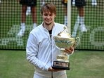Kazakhstan's Alexander Bublik holds the trophy after beating Russia's Andrey Rublev and winning the German Tennis Open, in Halle Kazakhstan's Alexander Bublik holds the trophy after beating Russia's Andrey Rublev and winning the German Tennis Open, in Halle