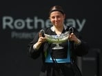 Latvia's Jelena Ostapenko celebrates with the trophy after winning her final match against Czech Republic's Barbora Krejcikova