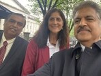 Anand Mahindra clicking a selfie with Mukesh Ambani (left), Sunita Williams and Vrinda Kapoor (right). 