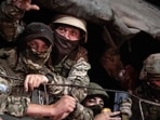 Members of Wagner group look from a military vehicle in Rostov-on-Don late on Saturday.