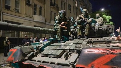 Membes of the Wagner Group military company sit atop of a tank on a street in Rostov-on-Don. (AP) Membes of the Wagner Group military company sit atop of a tank on a street in Rostov-on-Don. (AP)