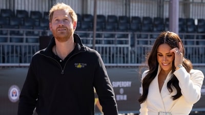 FILE - Prince Harry and Meghan Markle, Duke and Duchess of Sussex at the Invictus Games in The Hague, Netherlands, Sunday, April 17, 2022.  A spokesperson for Prince Harry and his wife Meghan says the couple were involved in a car chase while being followed by photographers. The couple’s office says the pair and Meghan’s mother were followed for more than two hours by a half-dozen vehicles after leaving a charity event in New York on Tuesday, May 16, 2023. (AP Photo/Peter Dejong, File) (AP)