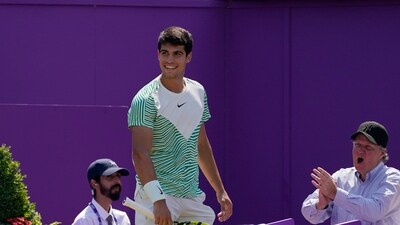 Carlos Alcaraz, of Spain, smiles during his mens singles final match against Alex de Minaur, of Australia, at the Queens Club tennis tournament (AP) Carlos Alcaraz, of Spain, smiles during his mens singles final match against Alex de Minaur, of Australia, at the Queens Club tennis tournament (AP)