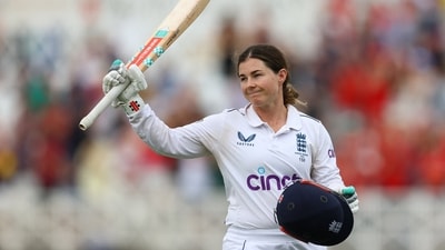 England's Tammy Beaumont acknowledges the crowd as she walks after losing her wicket for 208 runs (REUTERS)