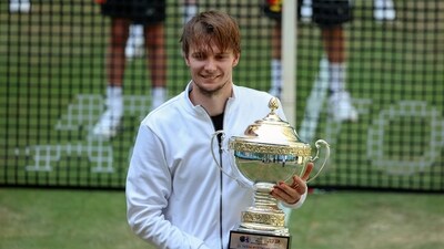 Kazakhstan's Alexander Bublik holds the trophy after beating Russia's Andrey Rublev and winning the German Tennis Open, in Halle (AP) Kazakhstan's Alexander Bublik holds the trophy after beating Russia's Andrey Rublev and winning the German Tennis Open, in Halle (AP)