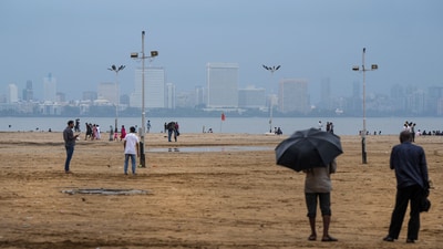 Haze covers the city skyline during monsoon season, in Mumbai, Sunday. (PTI)