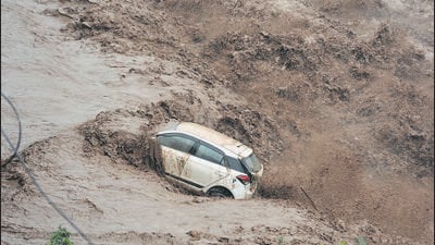 The Panchkula woman’s car that was swept away after flash floods triggered by rain in upper reaches on Sunday. (SANT ARORA) The Panchkula woman’s car that was swept away after flash floods triggered by rain in upper reaches on Sunday. (SANT ARORA)