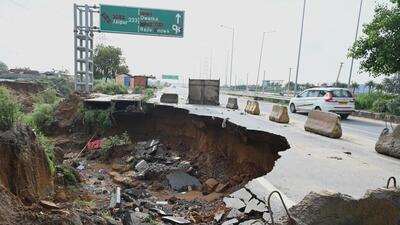 The road caved in after heavy rains lashed Gurugram on Sunday. (Parveen Kumar/ HT)