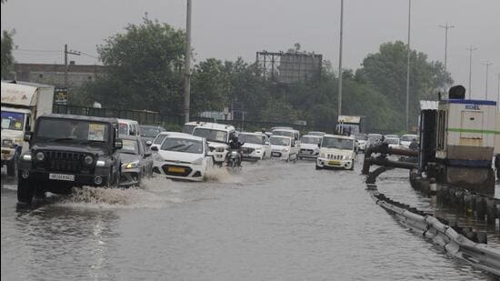 A waterlogged stretch on National Highway-48 in Gurugram on Sunday. (Parveen Kumar/HT Photo)