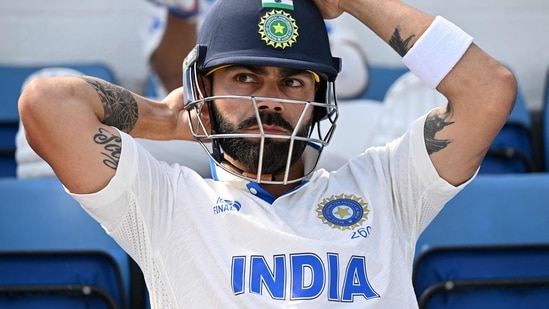 India's Virat Kohli prepares to walk out to bat (AFP)