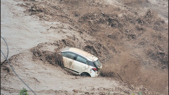The Panchkula woman’s car that was swept away after flash floods triggered by rain in upper reaches on Sunday. (SANT ARORA)