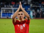 Indian team captain Sunil Chhetri acknowledges the crowd after winning a football match against Nepal