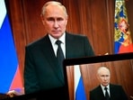 Russian President Vladimir Putin is seen on monitors as he addresses the nation after Yevgeny Prigozhin, the owner of the Wagner Group military company, called for armed rebellion and reached the southern city of Rostov-on-Don with his troops, in Moscow, Russia, Saturday.
