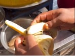 Street vendor making banana pani puri.
