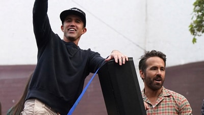 Ryan Reynolds, right, and Rob McElhenney are among new investors backing F1 team in $218 million deal. (AP)