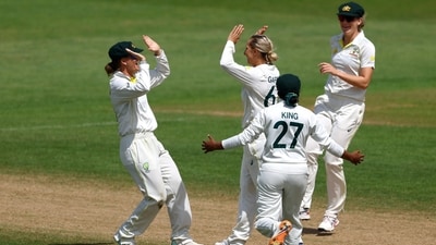 Ashleigh Gardner celebrates with teammates after taking the wicket of Danni Wyatt to win the Test (REUTERS)