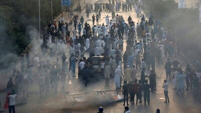 Supporters of Pakistan's former Prime Minister Imran Khan block a highway, during a protest against his arrest, in Karachi, Pakistan May 9, 2023. (REUTERS)