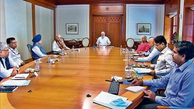 Prime Minister Narendra Modi chairs a meeting with senior ministers and officials in New Delhi on Monday. (PTI)