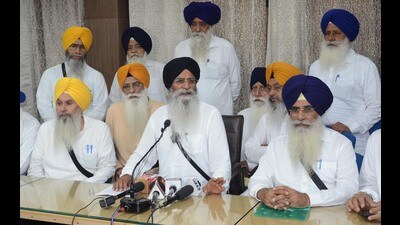 SGPC president Harjinder Singh Dhami (C) with other members addressing a press conference after general house meeting, in Amritsar on Monday. (Sameer Sehgal /HT)