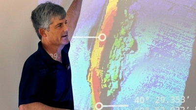 Stockton Rush speaks in front of a projected image of the wreckage of the ocean liner SS Andrea Doria during a presentation on their findings after an undersea exploration, on June 13, 2016, in Boston (AP Photo/Bill Sikes, File) (AP)