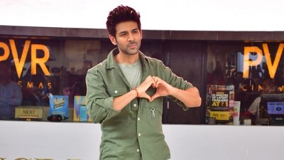 Kartik Aaryan also sported a green outfit for the event. The actor wore an olive green shirt with grey T-shirt. He completed his casual look with blue denims and dark shoes. He posed solo amid cheers from fans at the recent event. Kartik Aaryan also sported a green outfit for the event. The actor wore an olive green shirt with grey T-shirt. He completed his casual look with blue denims and dark shoes. He posed solo amid cheers from fans at the recent event. 