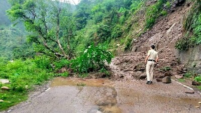 A tree fallen on a road in Himachal Pradesh due to inclement weather conditions that resulted in landslides. "It is informed that severe weather conditions with continuous rain and flash flood in Khoti Nala near Aut have blocked Mandi-Kullu National Highway," said an official statement. (HT Photo/Sanjeev Sharma) A tree fallen on a road in Himachal Pradesh due to inclement weather conditions that resulted in landslides. "It is informed that severe weather conditions with continuous rain and flash flood in Khoti Nala near Aut have blocked Mandi-Kullu National Highway," said an official statement. (HT Photo/Sanjeev Sharma)